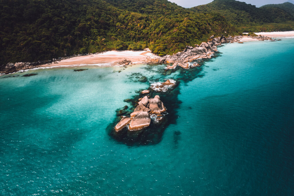 Big island Ilha Grande Abraao beach in Angra dos Reis, Rio de Janeiro, Brazil . High quality photo San Antonio Beach Praia San Antonio Lopes Mendes Beach in Background.